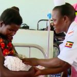 Still of nurse with mother from uganda video