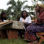 Nurse listening to patient in Jinja Uganda1024x